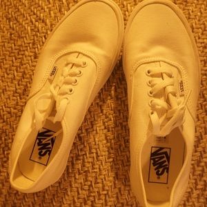 White, slightly lifted Vans sneakers. Women’s; Size (8.5). Never worn. Like new.